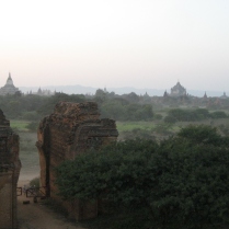 The sun going down in Bagan (our bikes are parked at the gate)